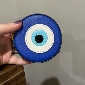 Kate Spade evil eye bag charm.